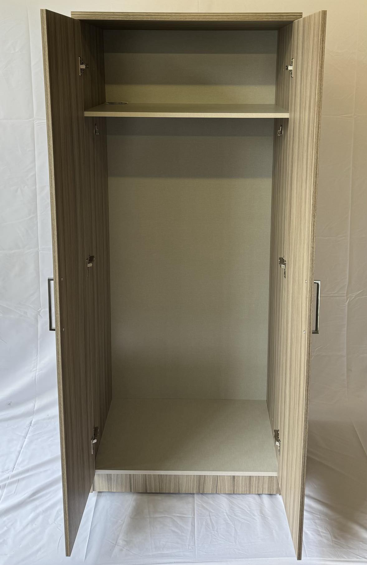 Inside view of Mode 2 door wardrobe in Driftwood finish.