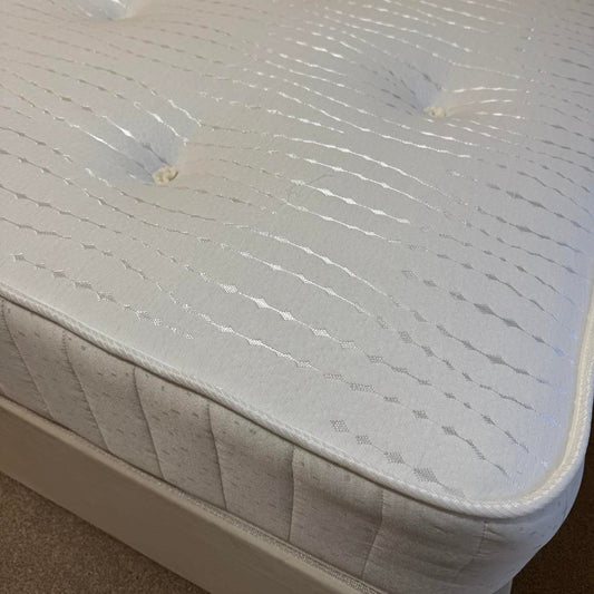 Keswick open-coil mattress. Made in the UK for Quality Plus Furniture. Soft kitted comfort layer with damask sides. Medium Firmness.