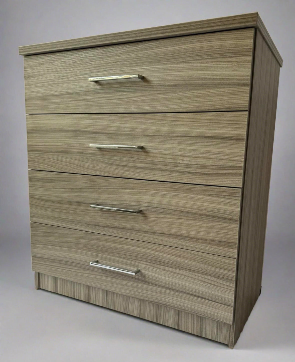 4 drawer mode chest. UK made in driftwood effect material. on wheels for easy movement