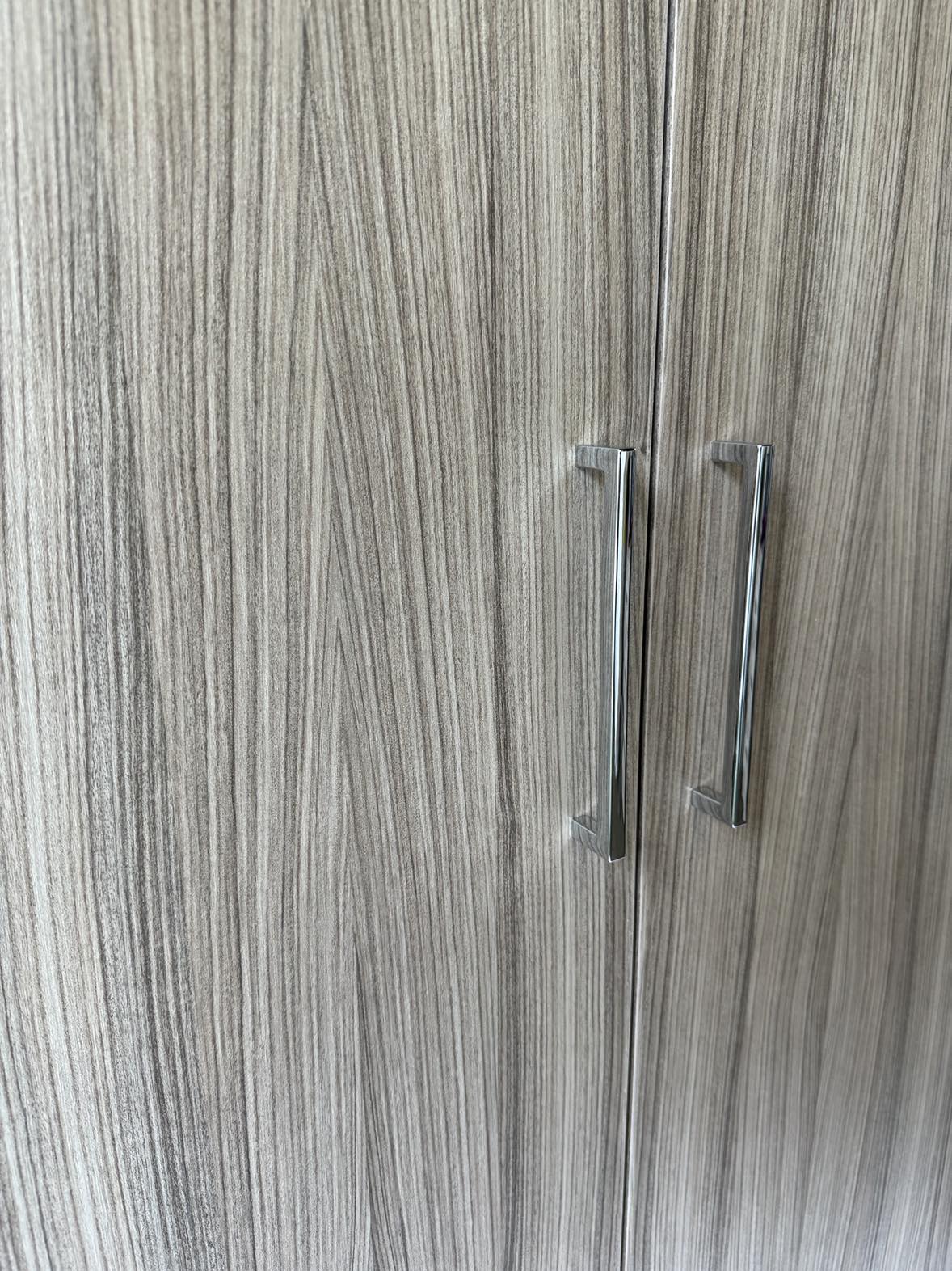 View of handles on Mode 2-door wardrobe. Driftwood finish and metal handles.