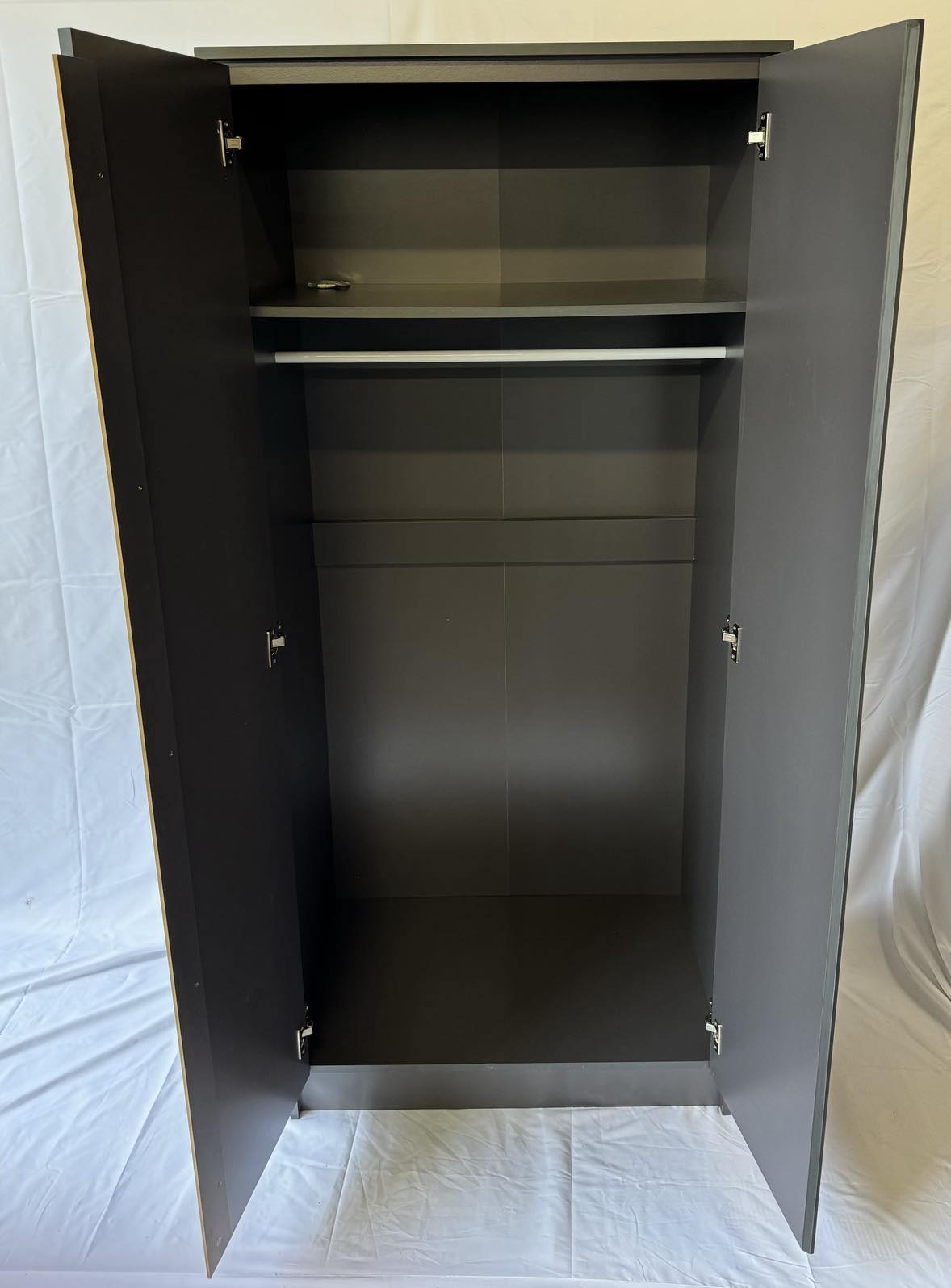 Storage inside Malve wardrobe similar to Malve. Shelving and hanging space 