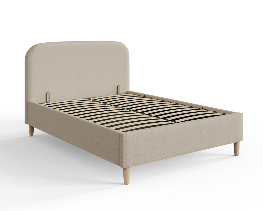 Boucle ottoman storage bed in natural stone with sprung slats.