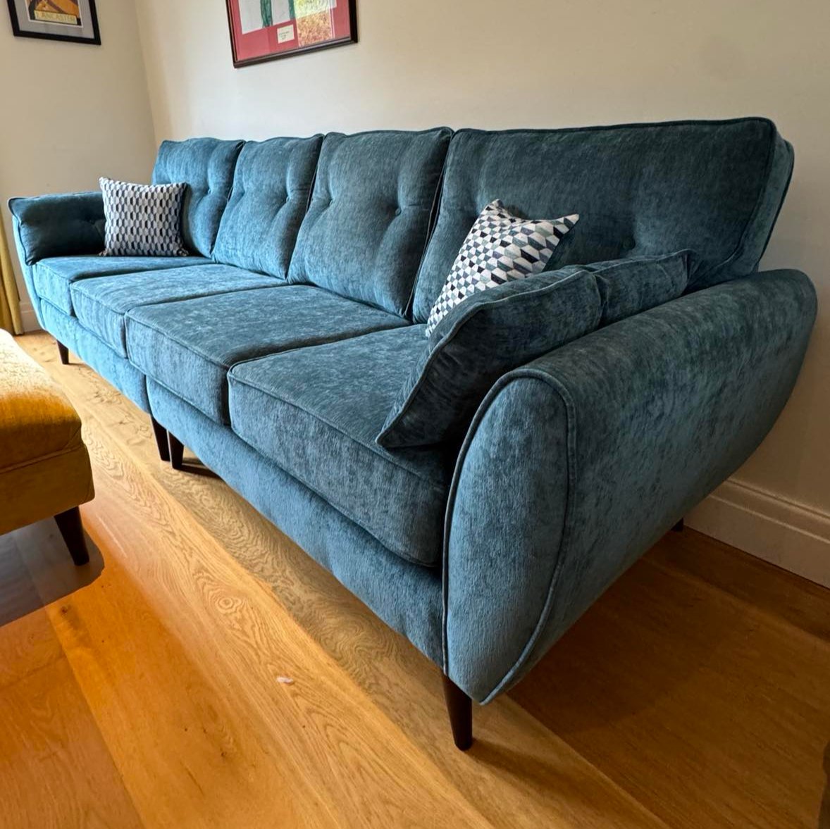 olive 4 seater sofa on strutted legs